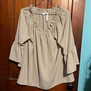 Lightweight tan top that goes about mid arm. Tag says L but i think more like XL